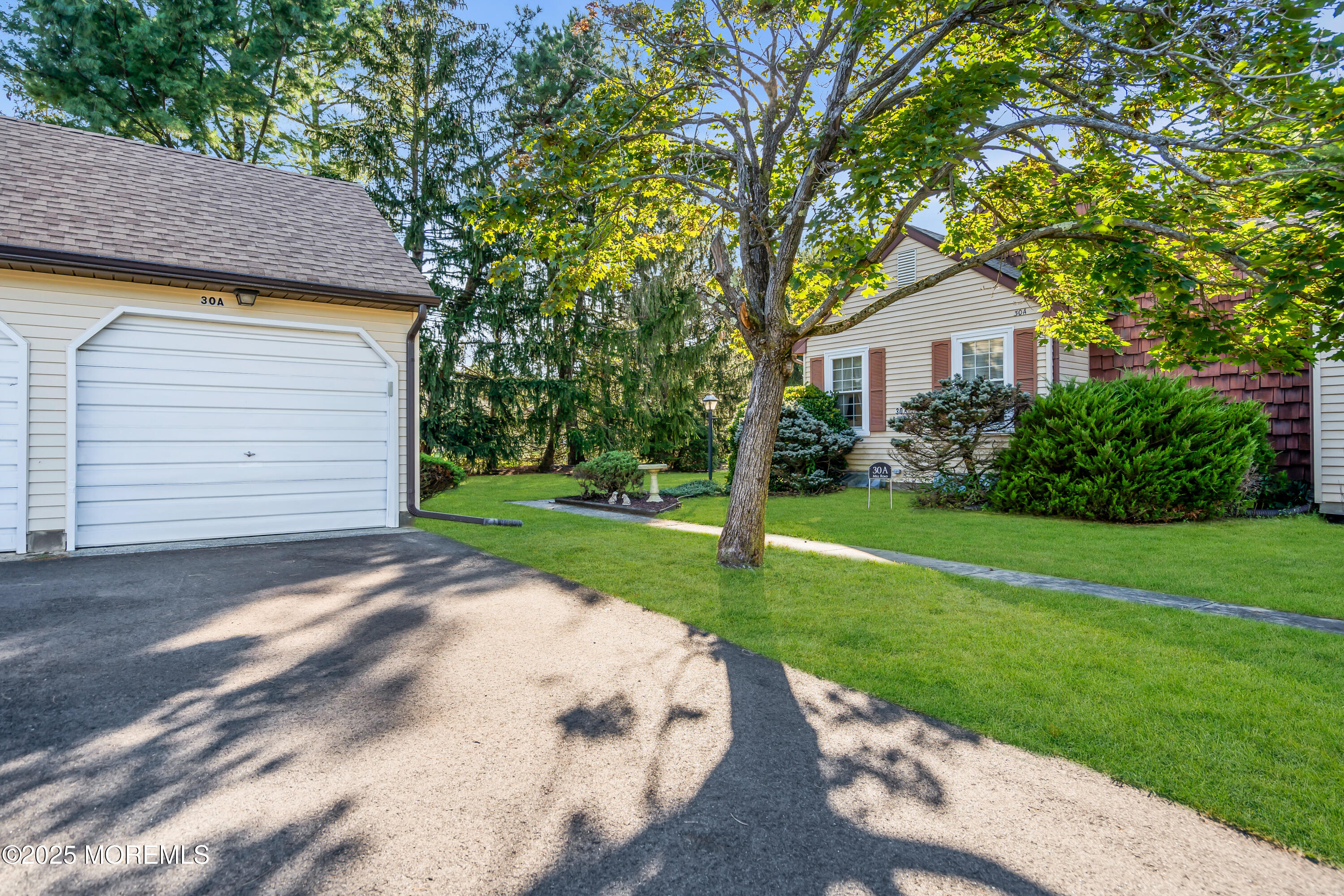 30 A Mill Road, Unit 64 Whiting, NJ 08759 - Photo 4 of 46 a front view of a house with a yard