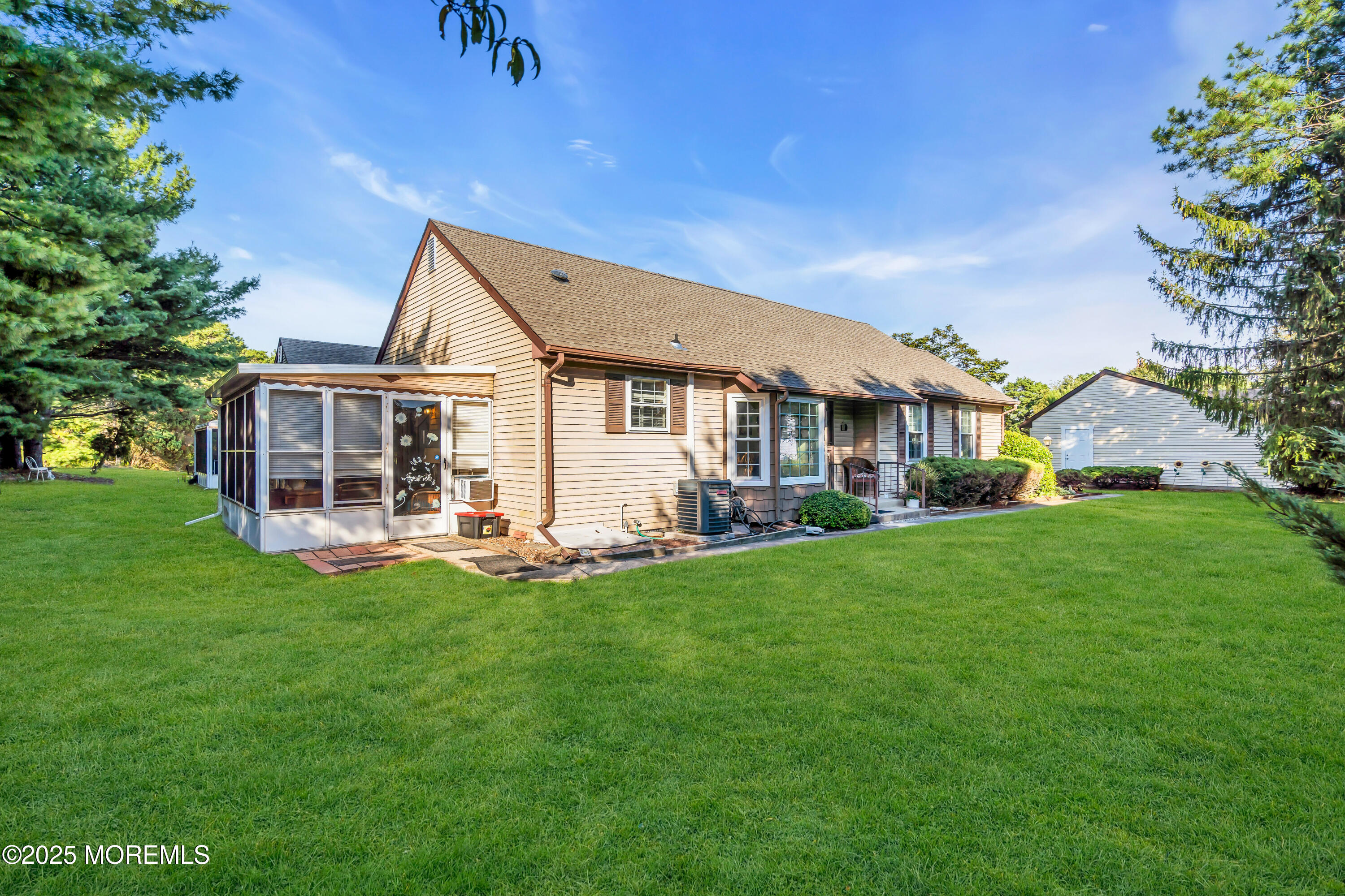 30 A Mill Road, Unit 64 Whiting, NJ 08759 - Photo 10 of 46 a front view of a house with a garden and porch