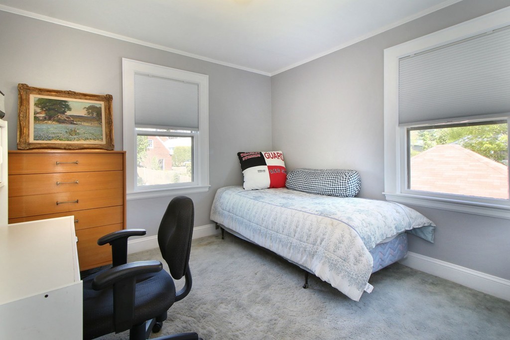 144 Lovell Road Watertown, MA 02472 - Photo 12 of 25 a bedroom with a bed and a window