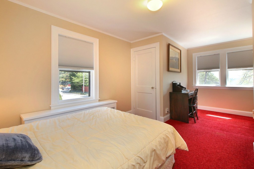 144 Lovell Road Watertown, MA 02472 - Photo 17 of 25 a bedroom with a bed and a window