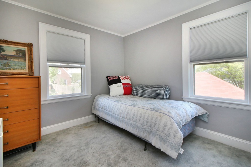 144 Lovell Road Watertown, MA 02472 - Photo 18 of 25 a bedroom with a bed and window
