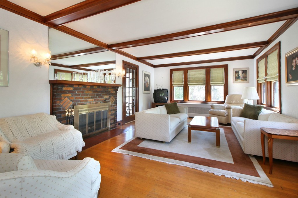 144 Lovell Road Watertown, MA 02472 - Photo 4 of 25 a living room with furniture and a fireplace