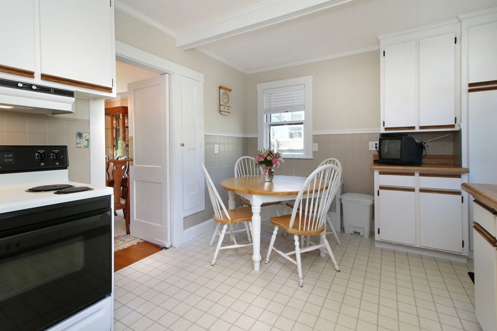 144 Lovell Road Watertown, MA 02472 - Photo 6 of 25 a view of a dining room with furniture and window
