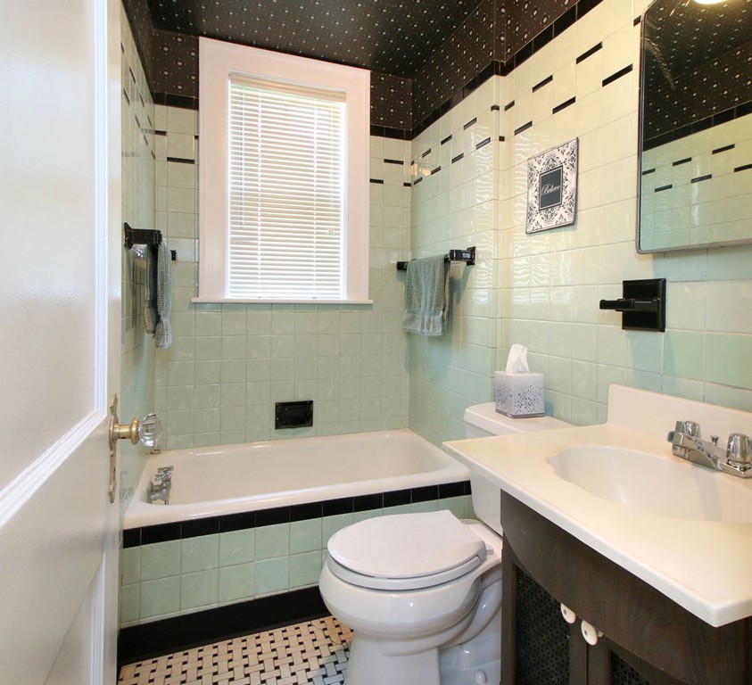 144 Lovell Road Watertown, MA 02472 - Photo 10 of 25 a bathroom with a sink toilet and a mirror