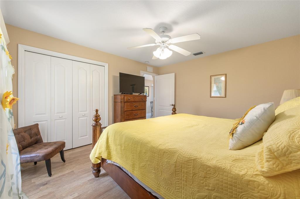 18825 Southwest 93rd Loop Dunnellon, FL 34432 - Photo 30 of 85 a bed room with a bed and a chair