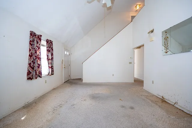 a view of a hallway with paintings on the wall
