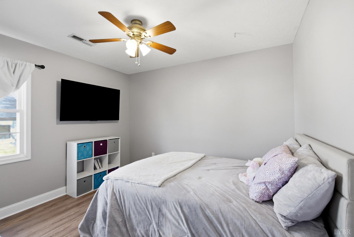 181 Armistead Lane Rustburg, VA 24588 - Photo 23 of 52 a bedroom with a bed and a flat screen tv