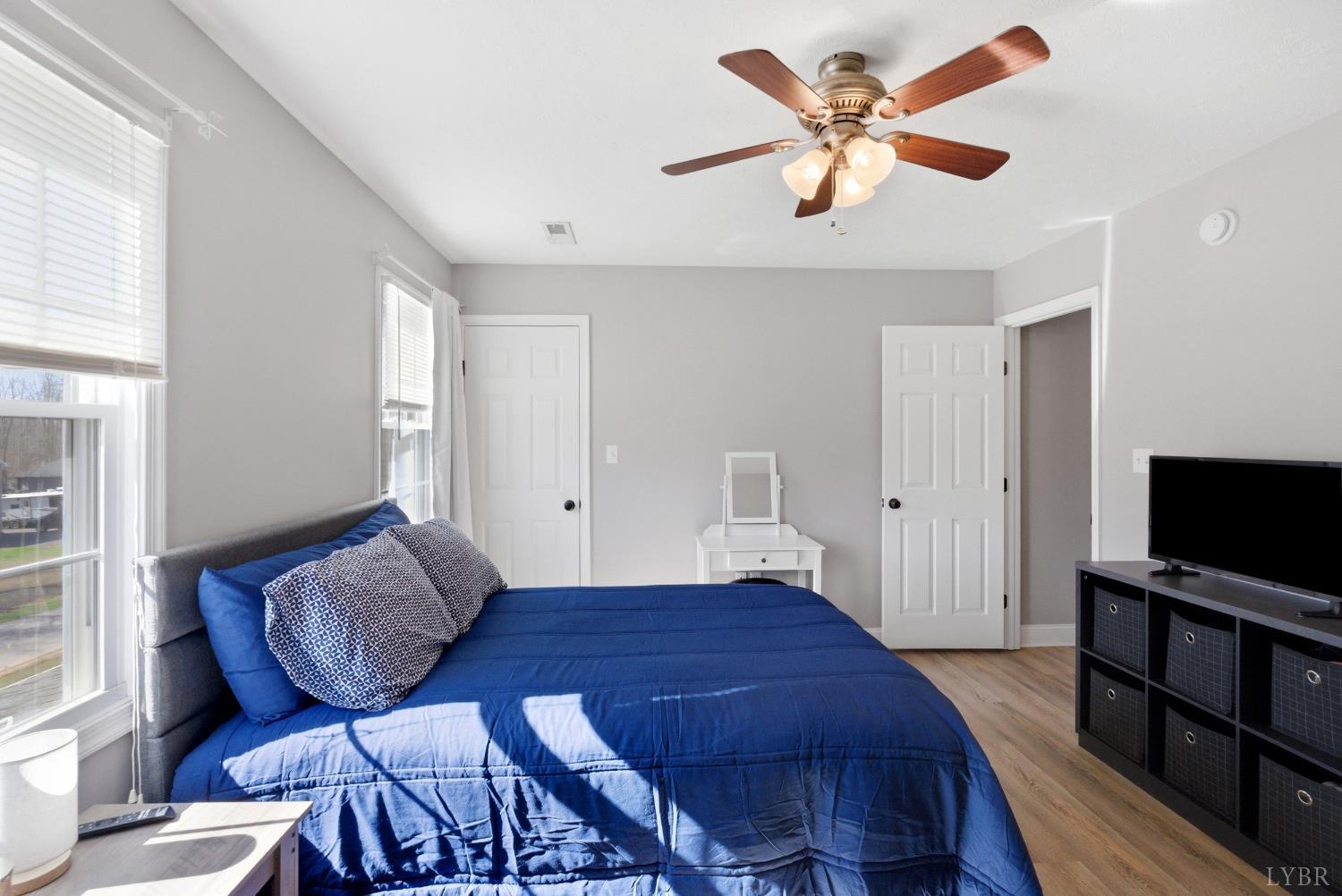 181 Armistead Lane Rustburg, VA 24588 - Photo 26 of 52 a bedroom with a bed and a flat screen tv