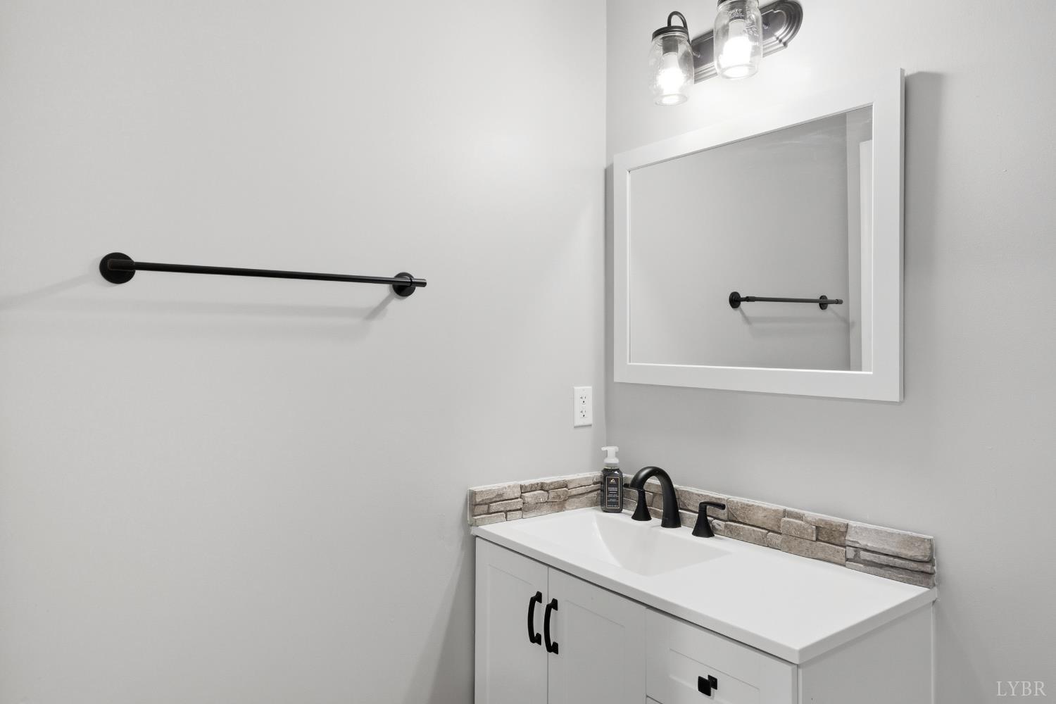 181 Armistead Lane Rustburg, VA 24588 - Photo 27 of 52 a bathroom with a sink and a mirror