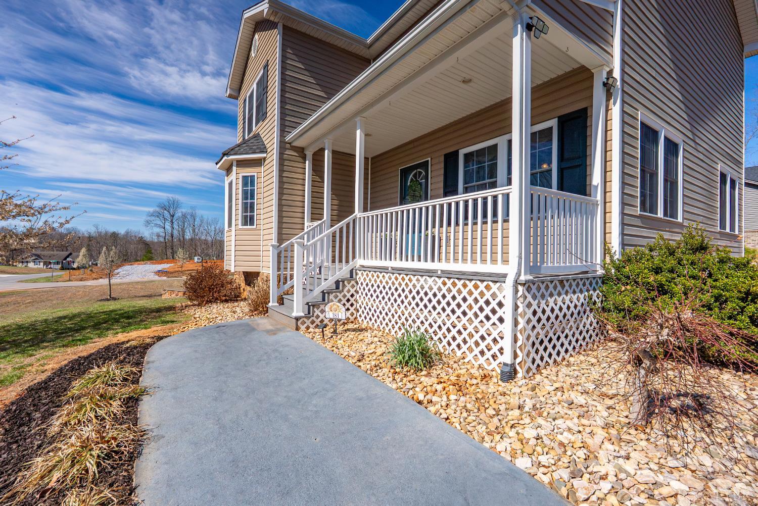 181 Armistead Lane Rustburg, VA 24588 - Photo 35 of 52 a front view of a house with a garden