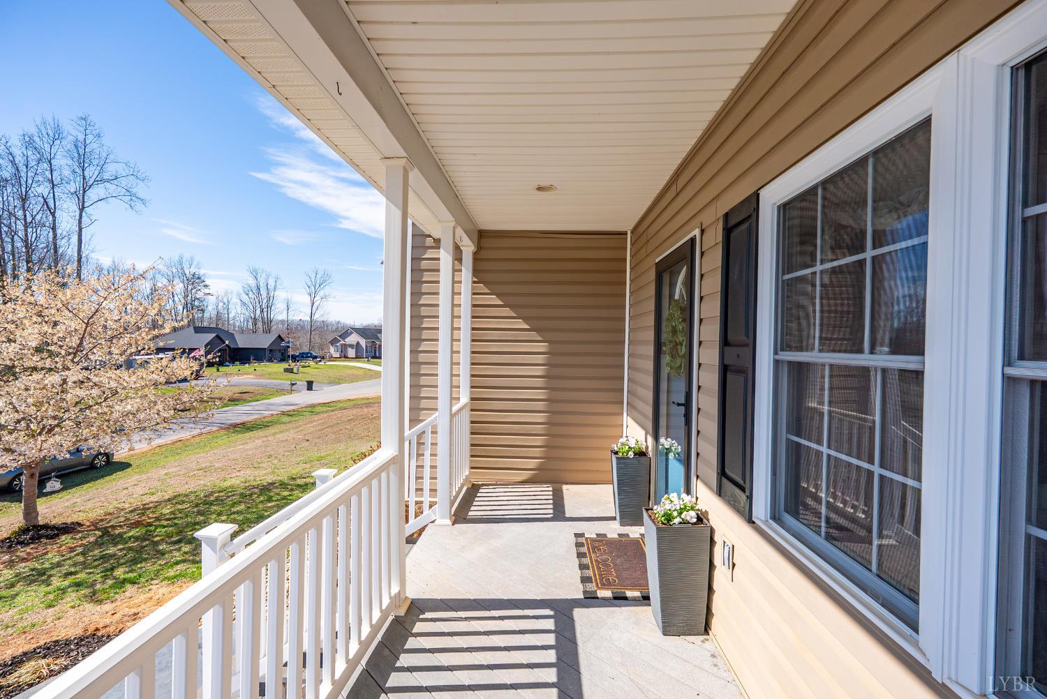 181 Armistead Lane Rustburg, VA 24588 - Photo 36 of 52 a view of a porch with wooden floor and floor to ceiling window