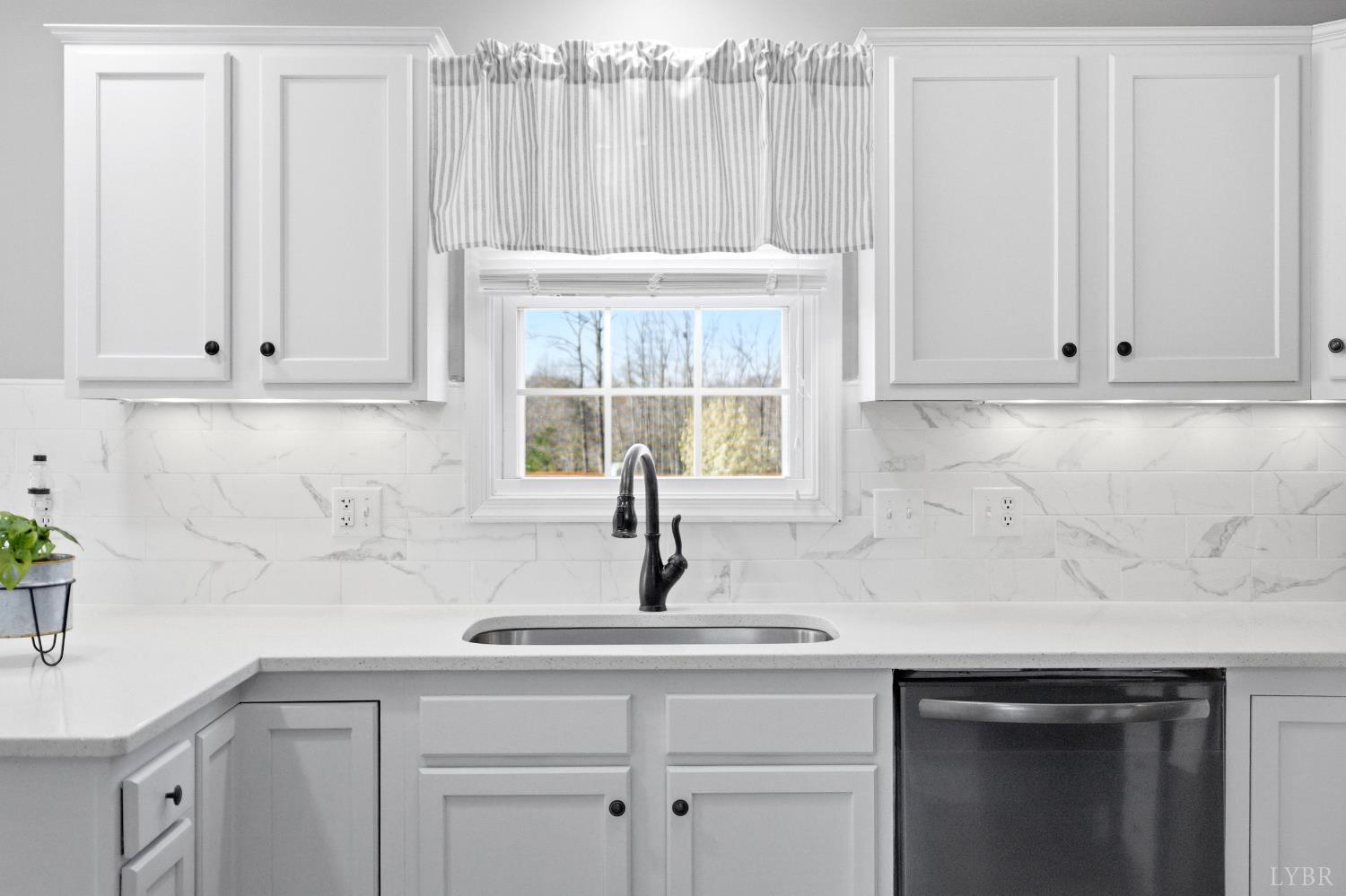 181 Armistead Lane Rustburg, VA 24588 - Photo 10 of 52 a kitchen with white cabinets and a sink