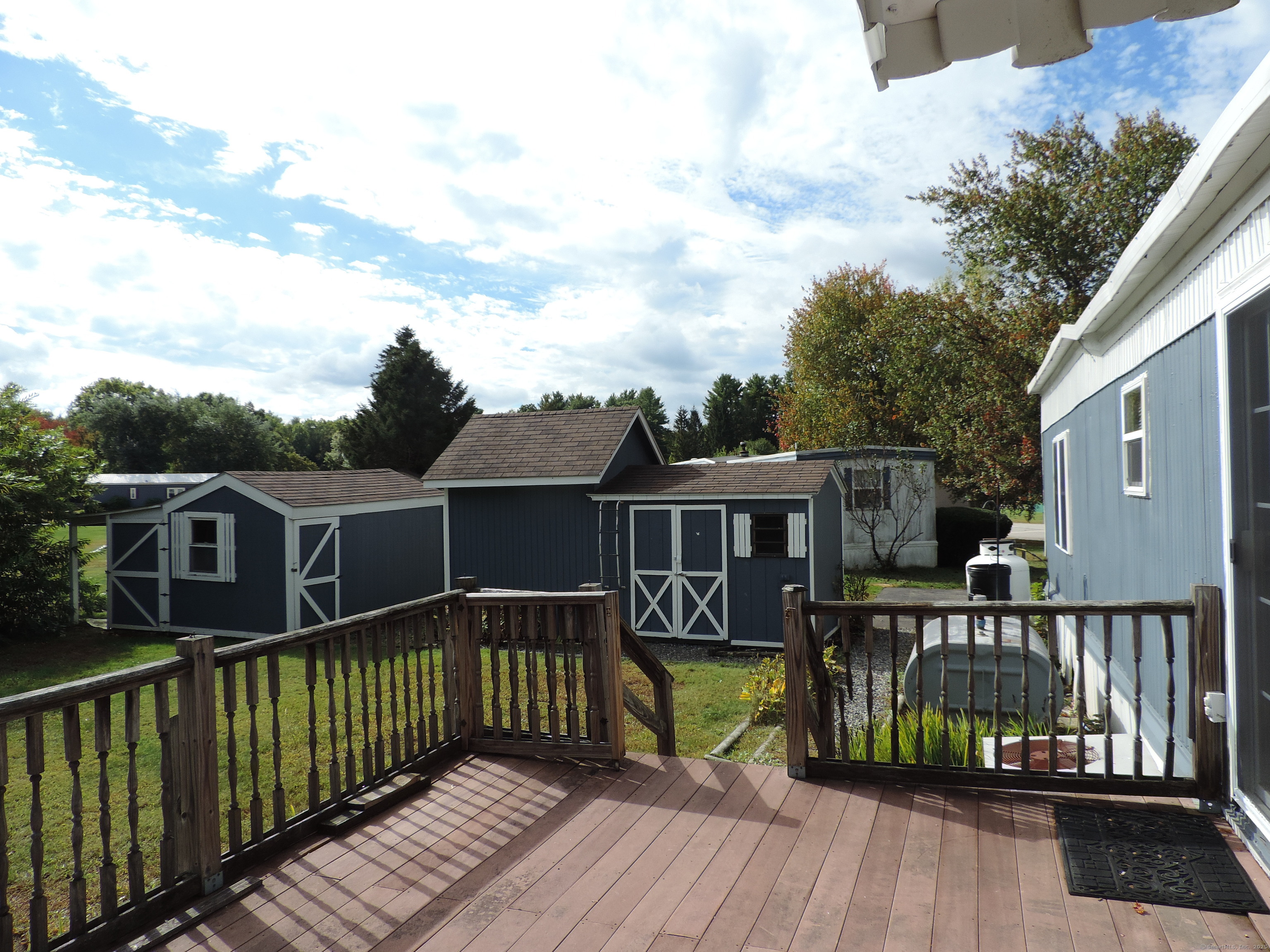 81 Parkway Drive Thompson, CT 06277 - Photo 2 of 7 a view of a house with wooden deck