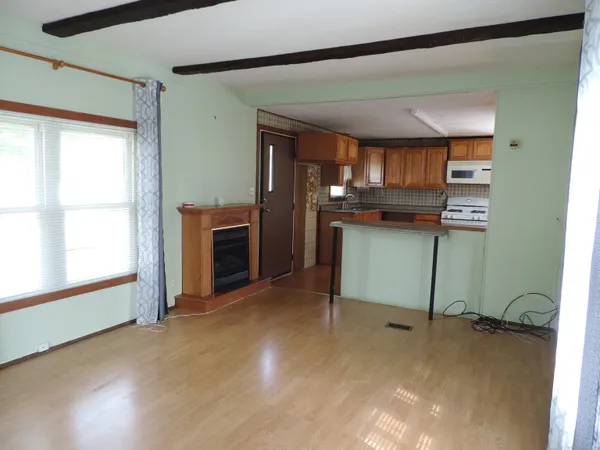 a view of a room with furniture and window