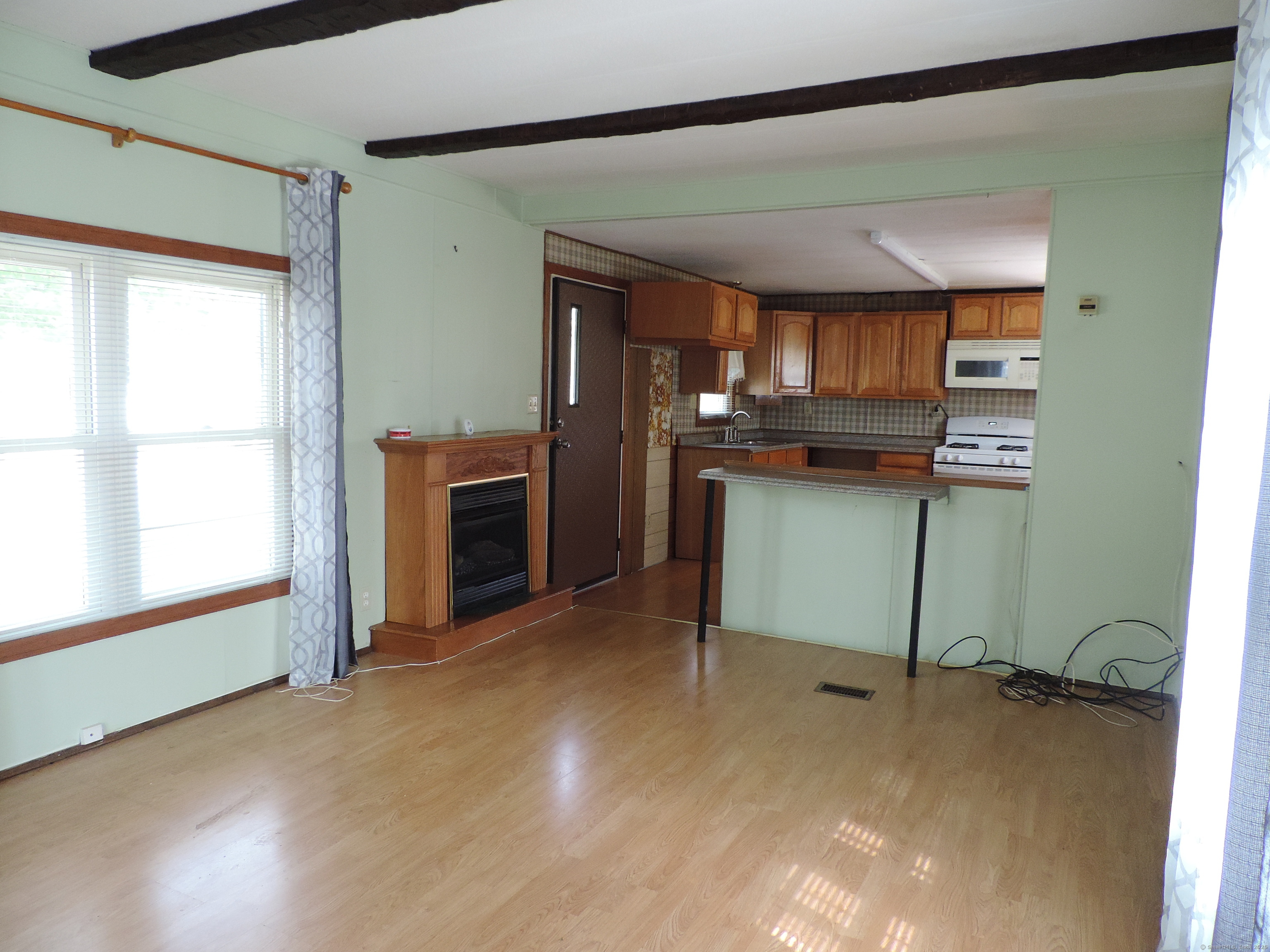 81 Parkway Drive Thompson, CT 06277 - Photo 4 of 7 a view of a room with furniture and window
