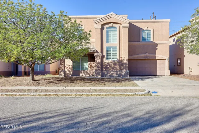 a view of a house with a street