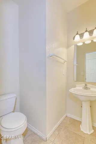 a bathroom with a sink vanity and a mirror