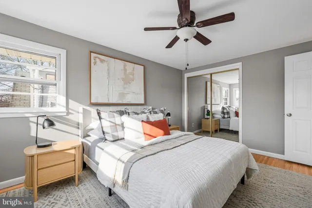 a bedroom with bed and window