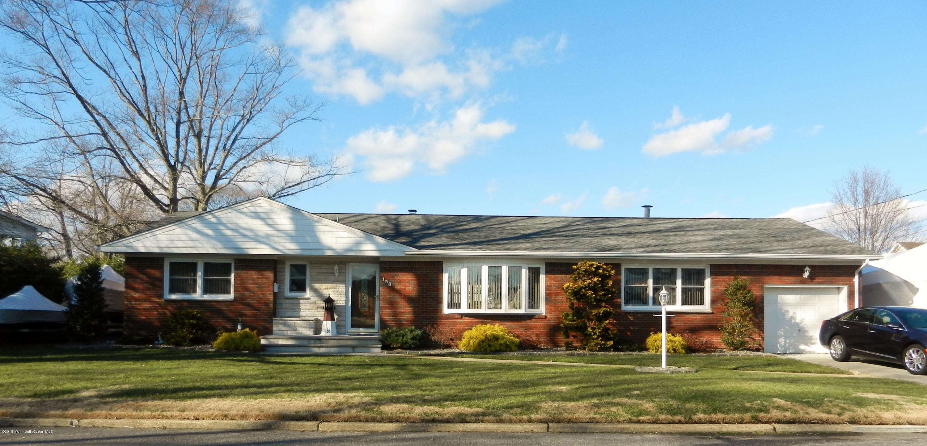 158 Cliff Road Brick, NJ 08724 - Photo 1 of 25 a front view of a house with a yard