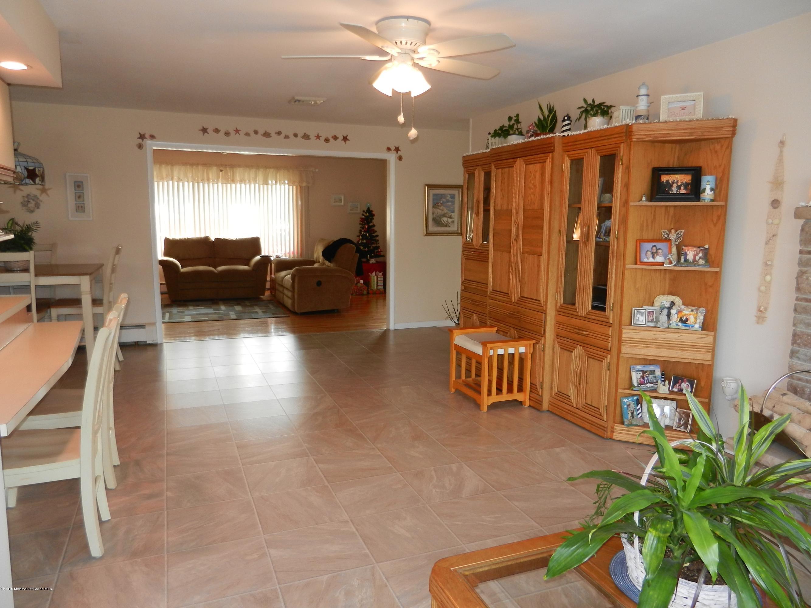 158 Cliff Road Brick, NJ 08724 - Photo 11 of 25 a living room with furniture and a chandelier