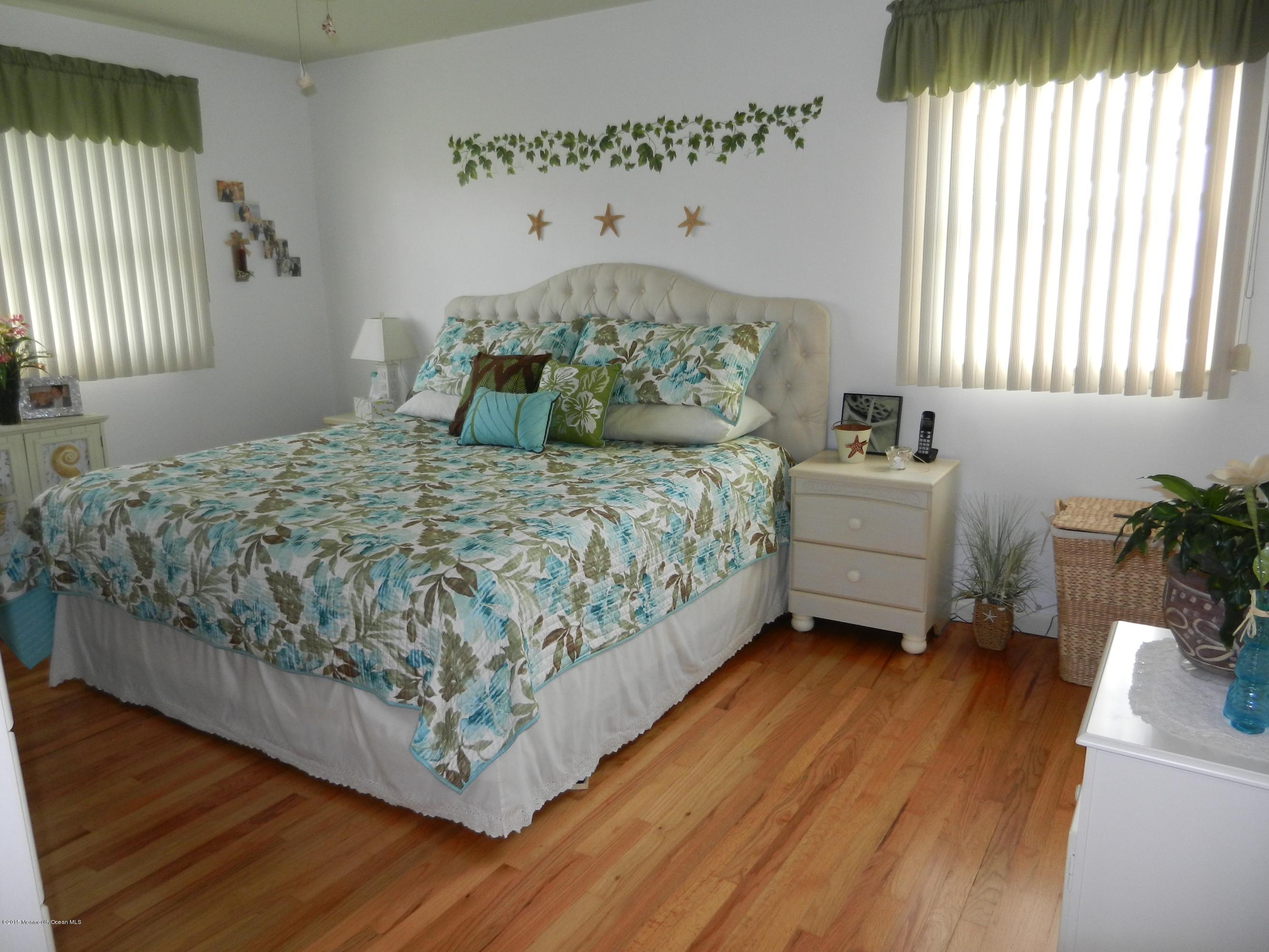 158 Cliff Road Brick, NJ 08724 - Photo 13 of 25 a bed sitting in a bedroom next to a window