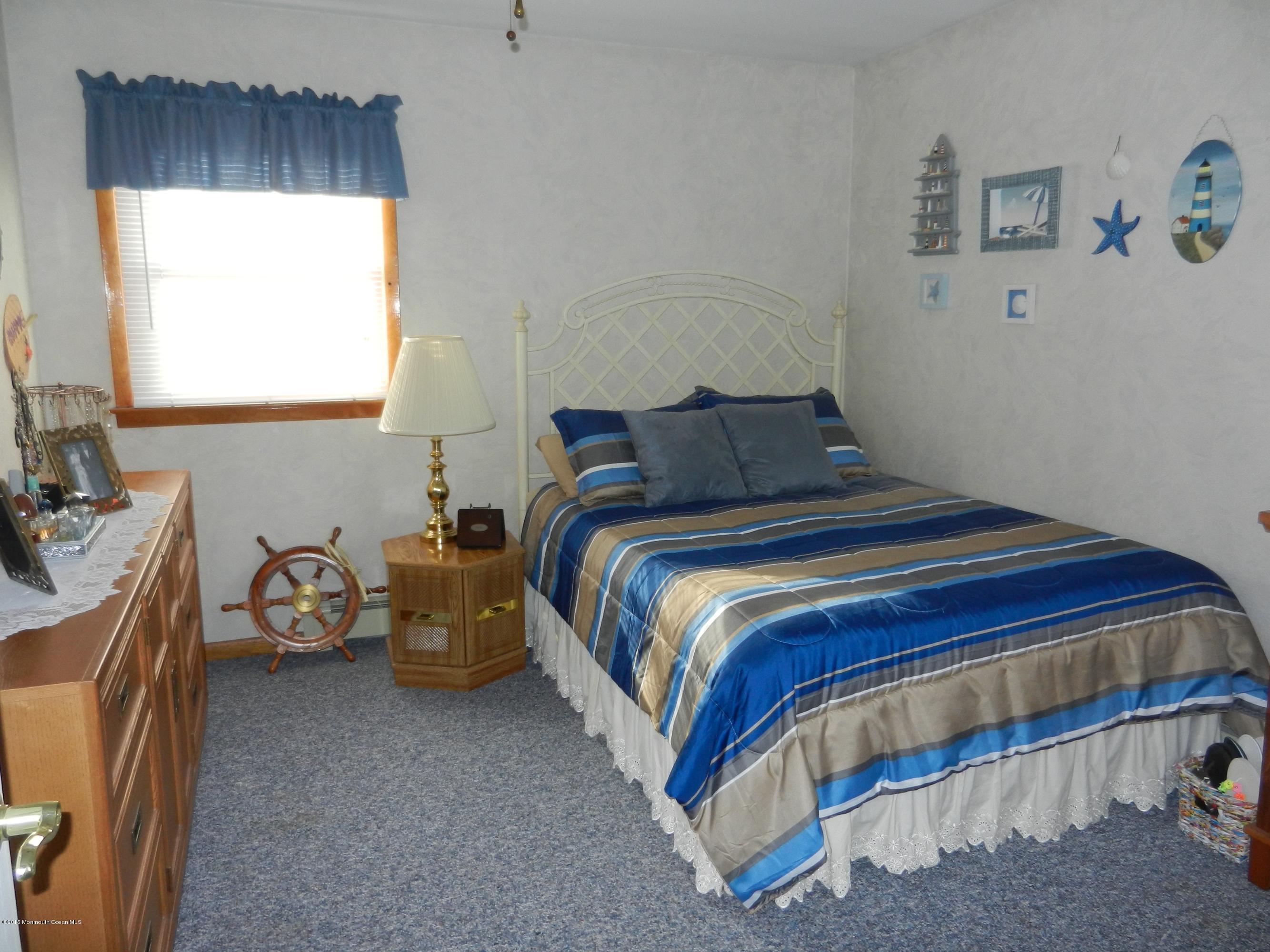 158 Cliff Road Brick, NJ 08724 - Photo 14 of 25 a bedroom with a bed and a couch