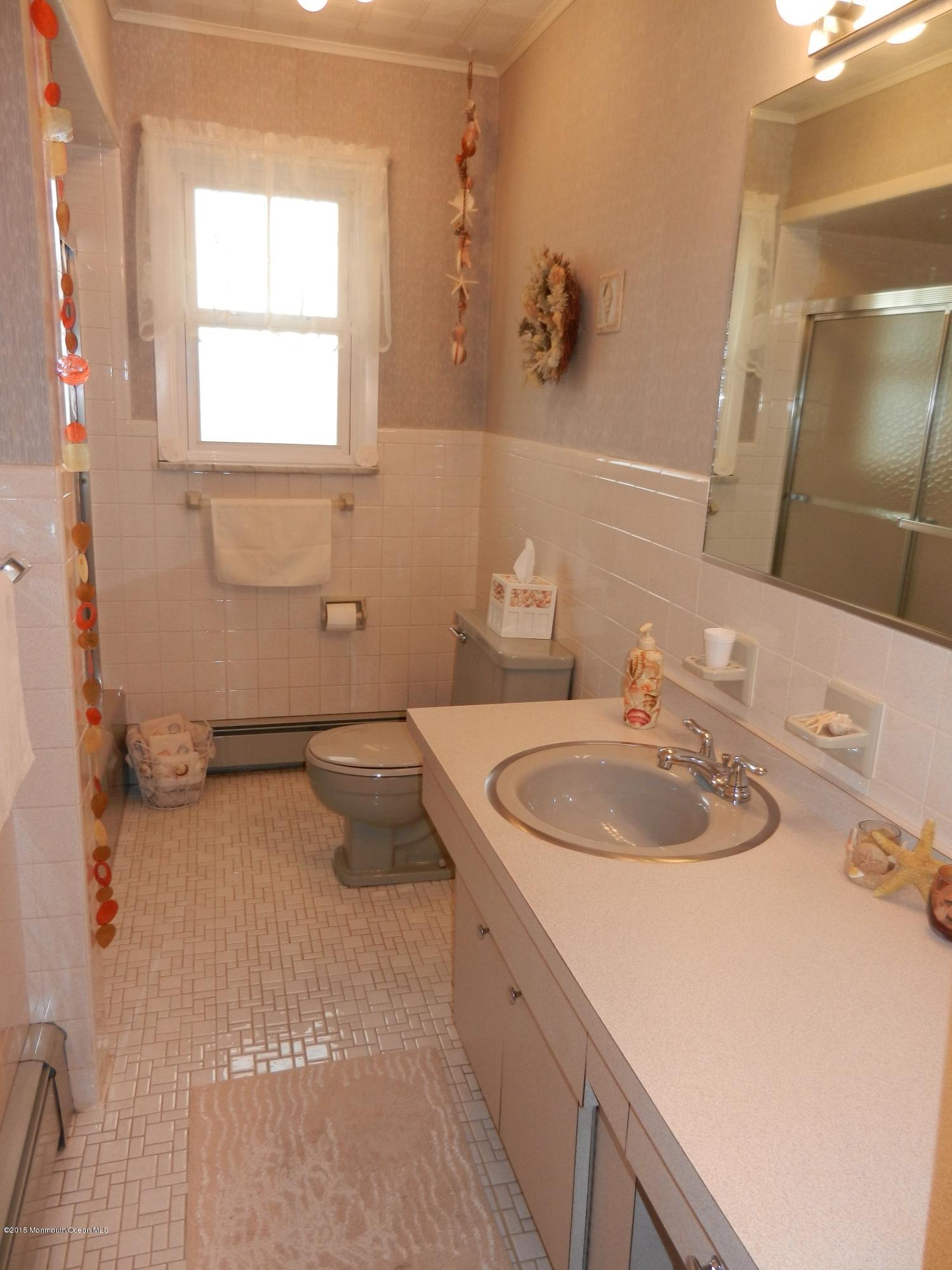 158 Cliff Road Brick, NJ 08724 - Photo 15 of 25 a bathroom with a sink and a mirror