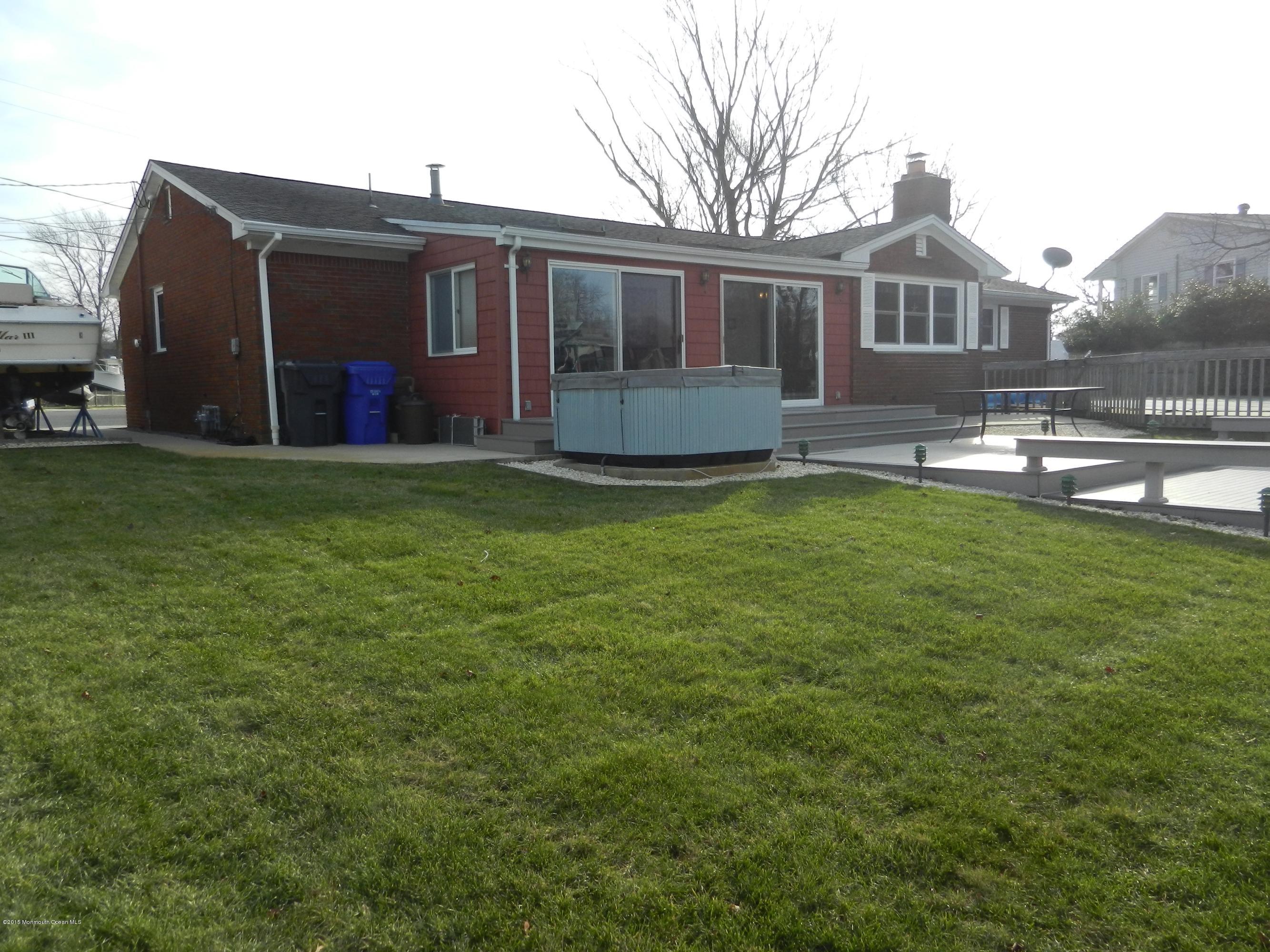 158 Cliff Road Brick, NJ 08724 - Photo 20 of 25 a view of a house with a backyard and a patio