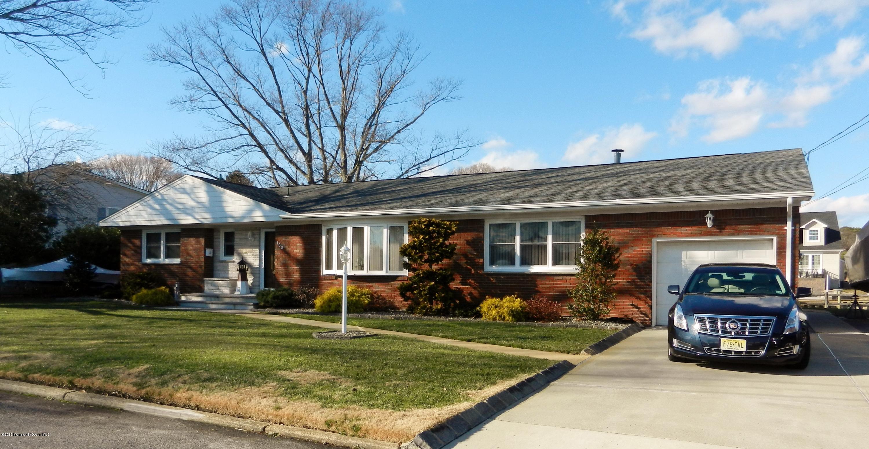 158 Cliff Road Brick, NJ 08724 - Photo 2 of 25 a view of a house with back yard and a car parked in front of it
