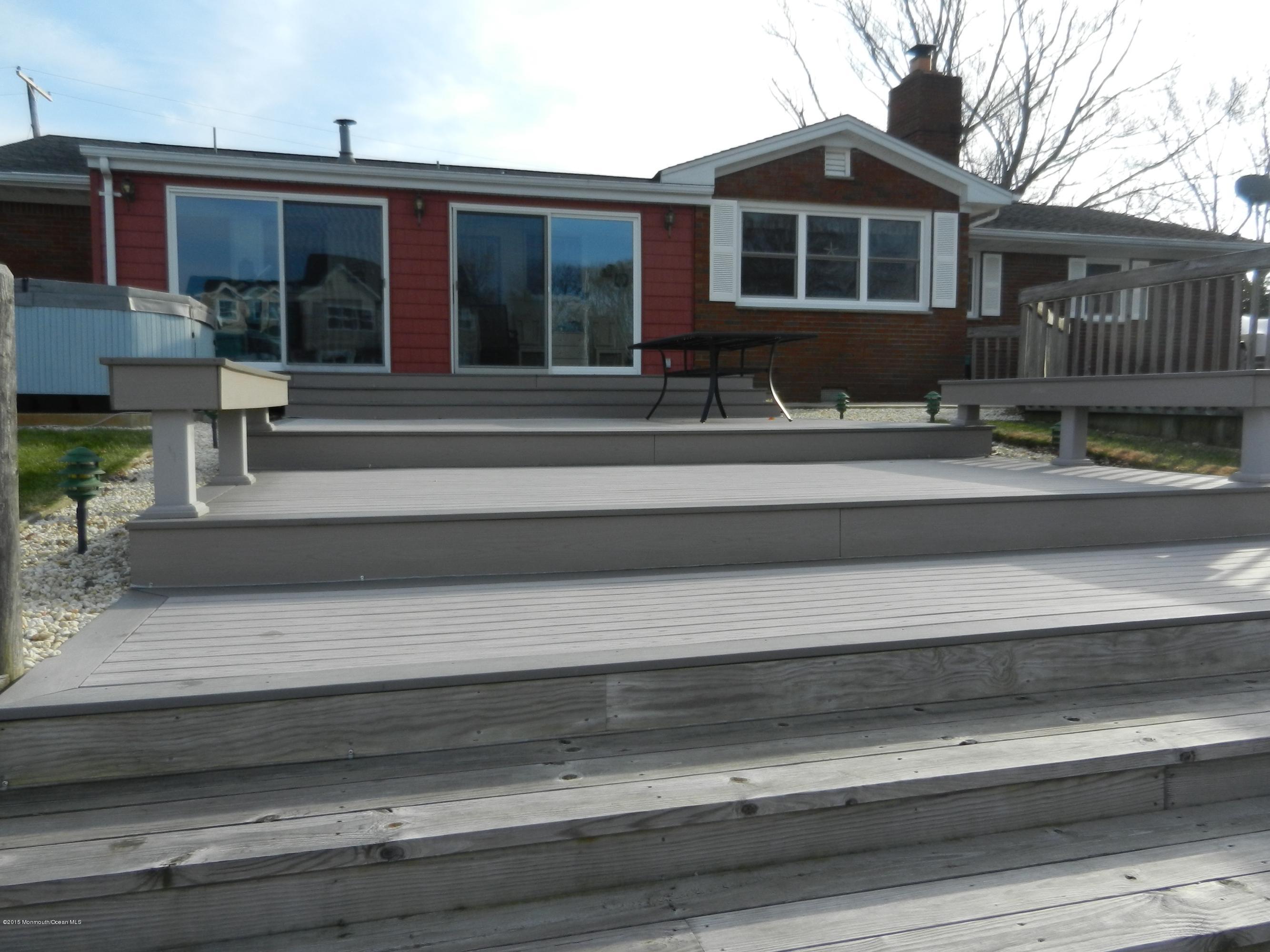 158 Cliff Road Brick, NJ 08724 - Photo 21 of 25 a front view of a house with a porch