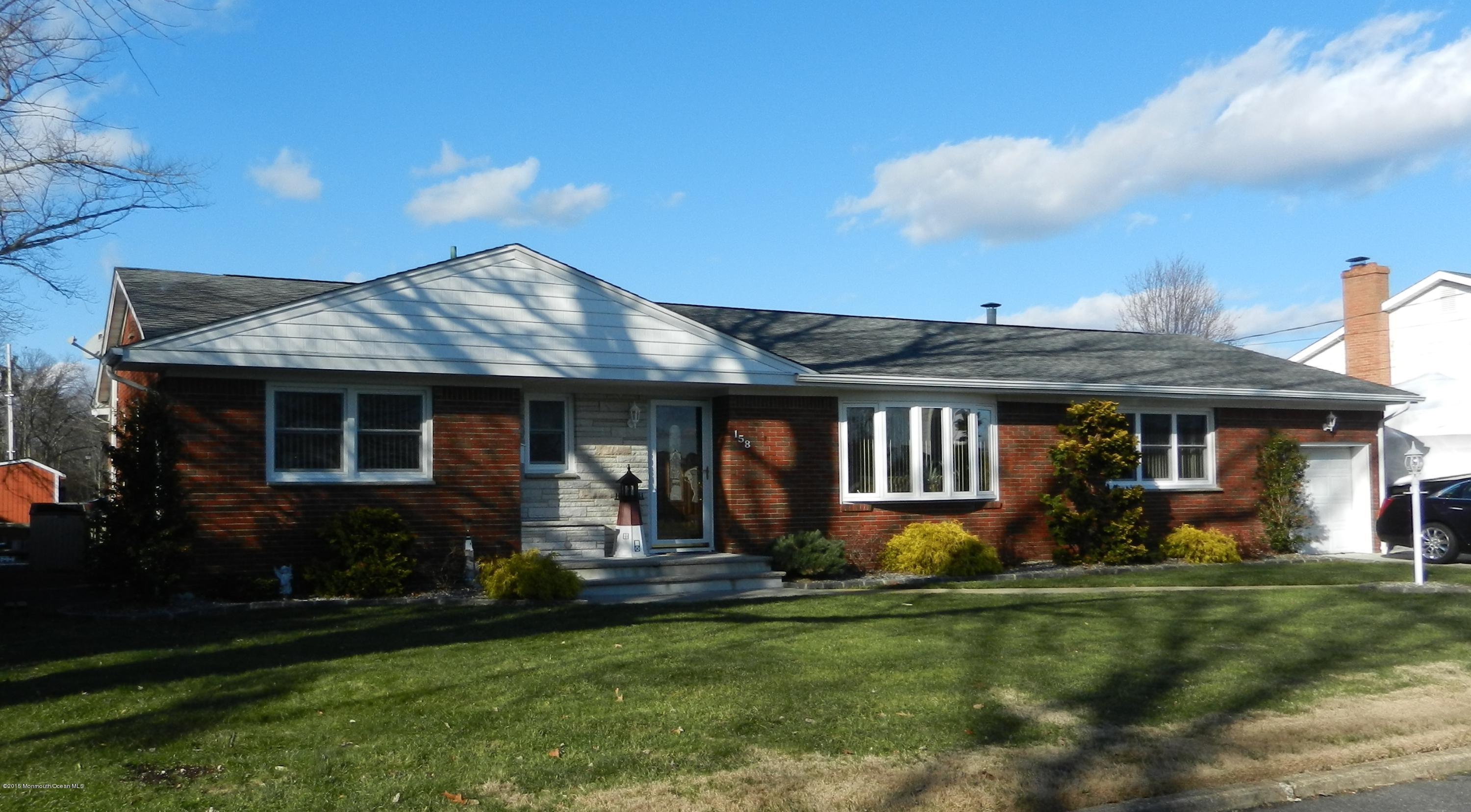 158 Cliff Road Brick, NJ 08724 - Photo 4 of 25 a front view of house with yard and green space