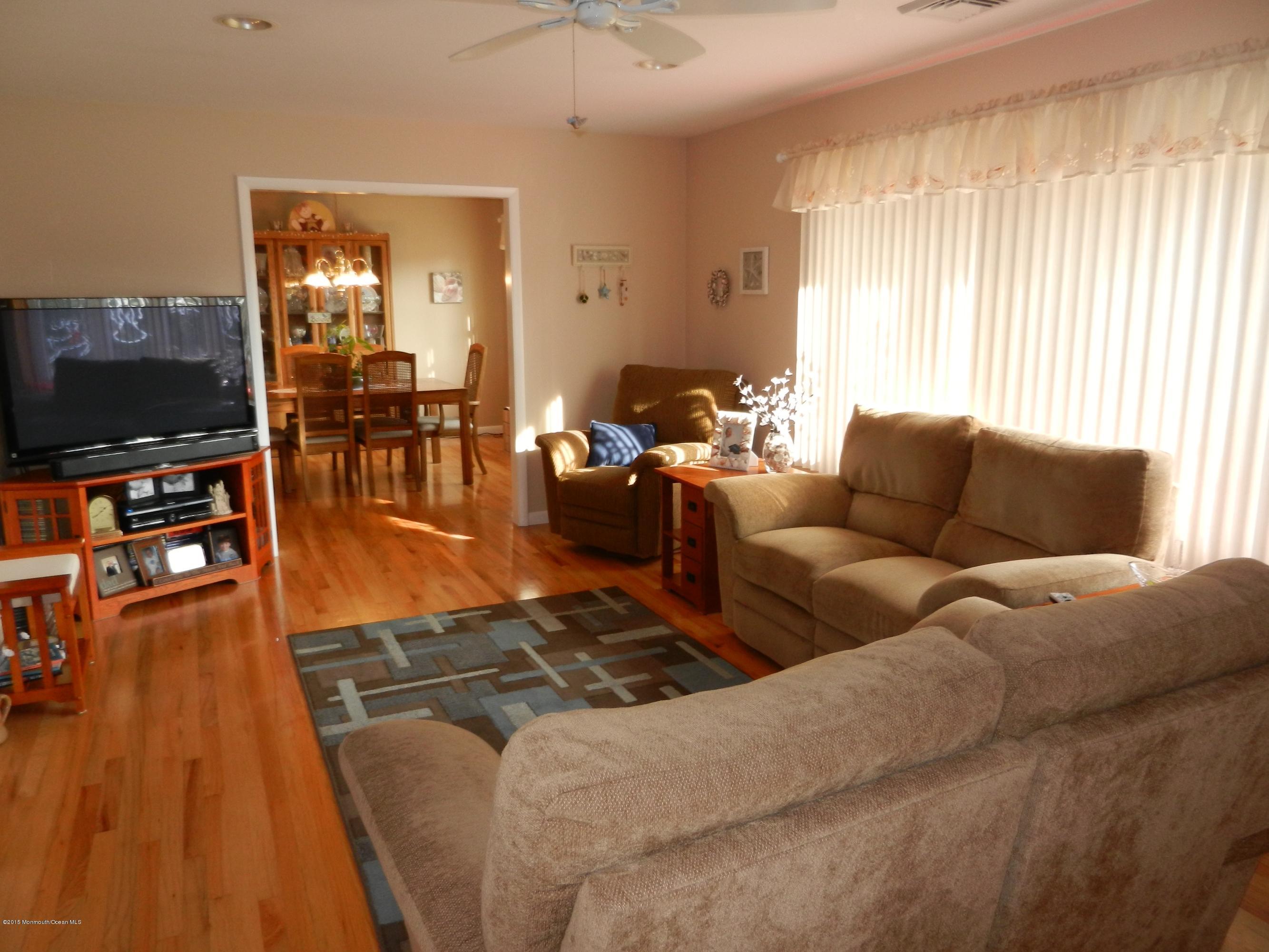 158 Cliff Road Brick, NJ 08724 - Photo 5 of 25 a living room with furniture and a flat screen tv