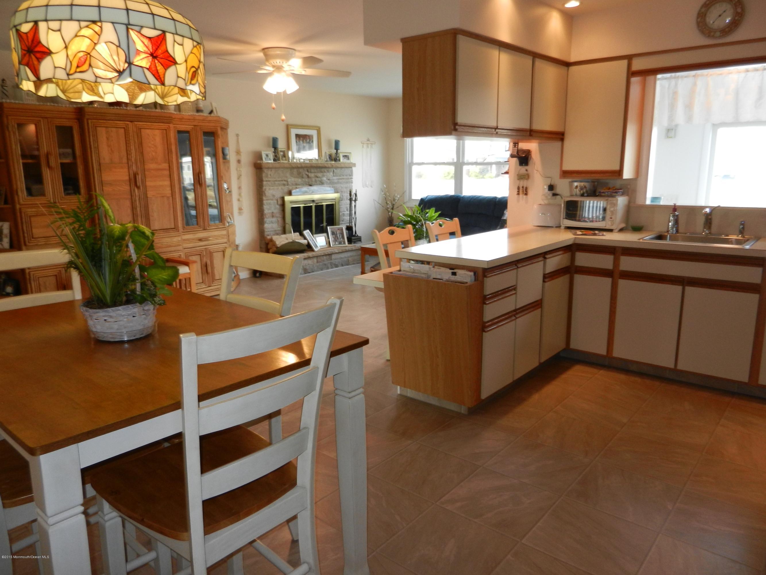 158 Cliff Road Brick, NJ 08724 - Photo 8 of 25 a kitchen with stainless steel appliances granite countertop a stove a sink and a refrigerator