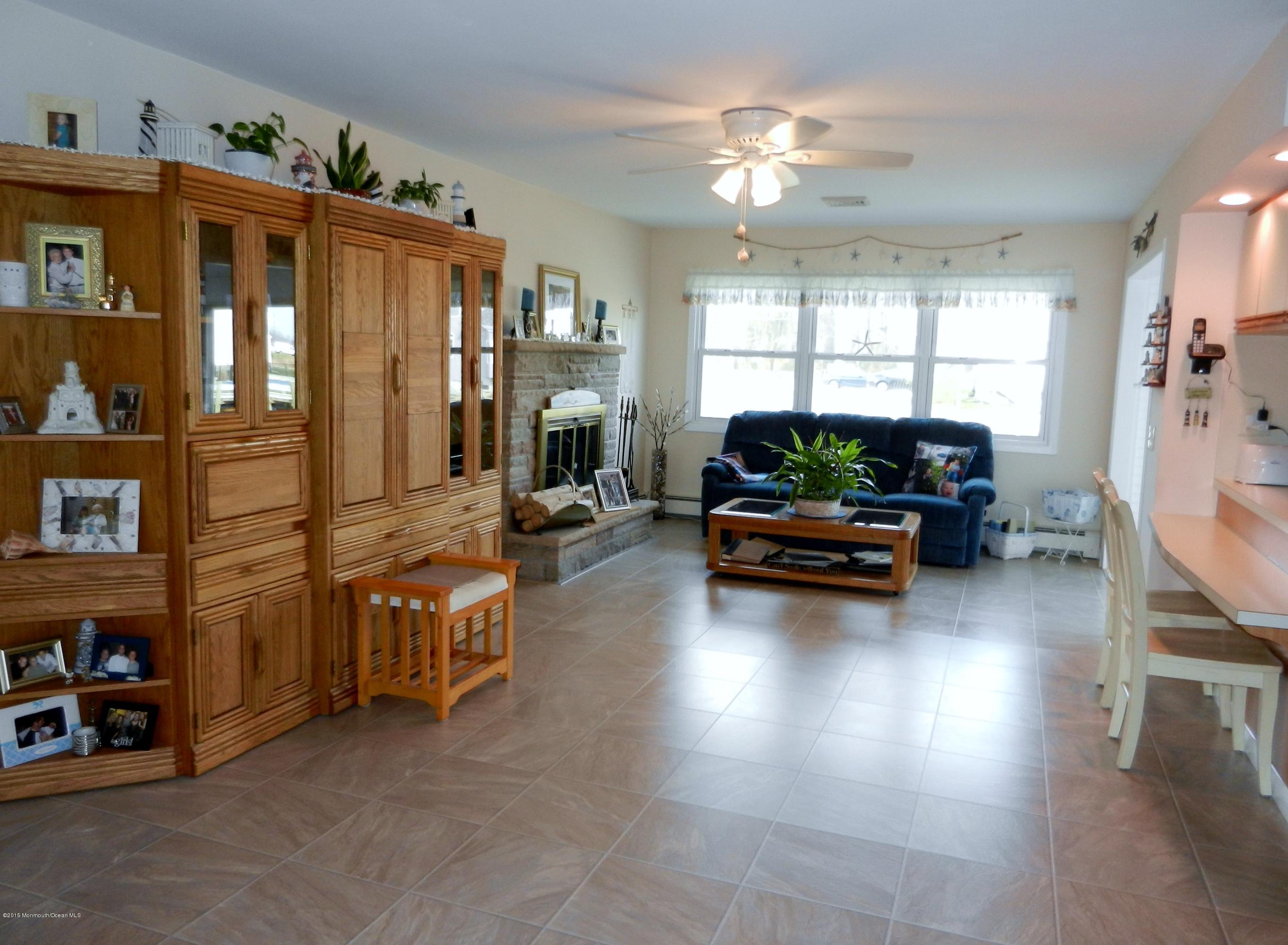 158 Cliff Road Brick, NJ 08724 - Photo 10 of 25 a living room with furniture window and a chandelier