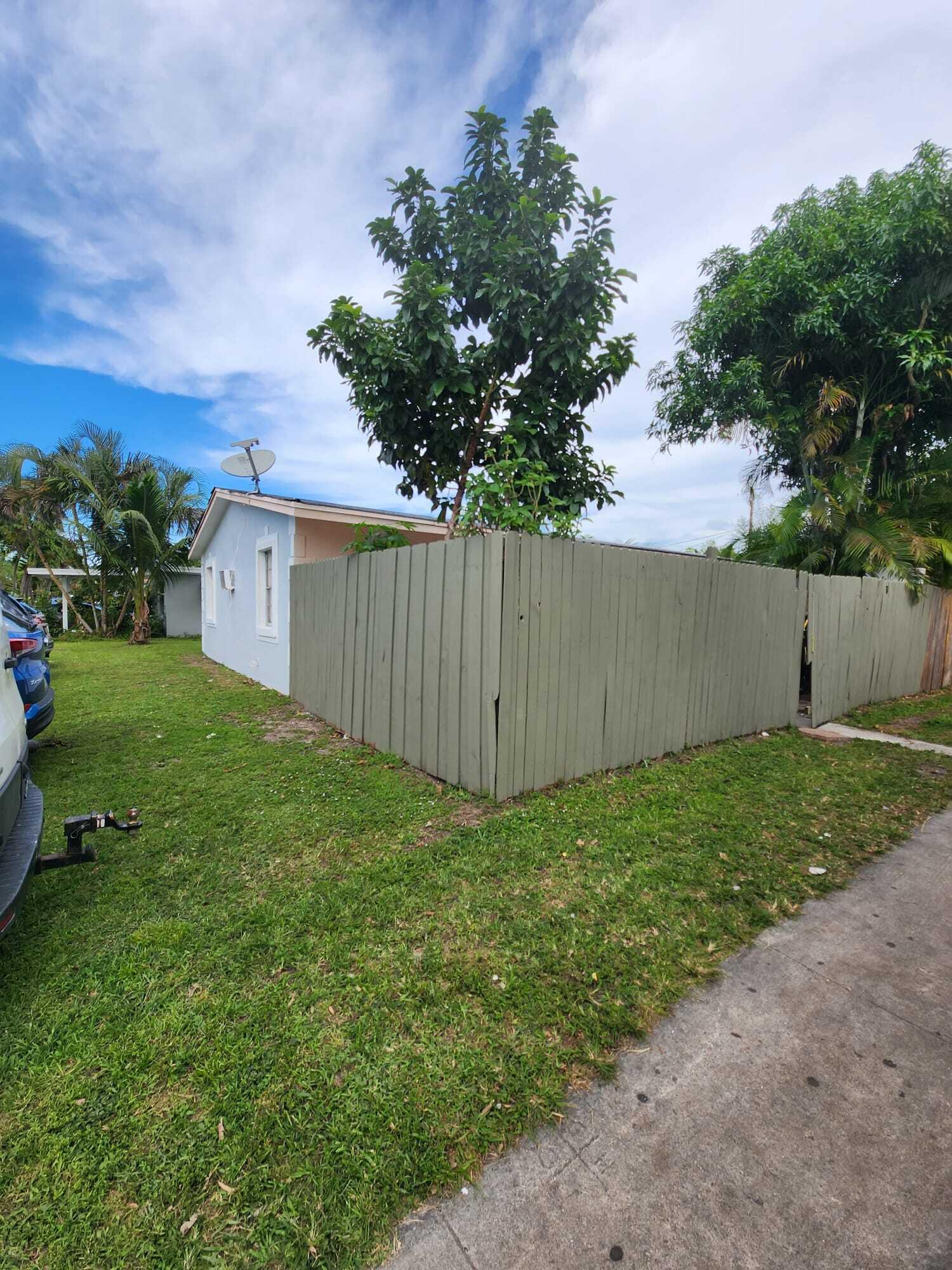 3386 Rudolph Road Lake Worth Beach, FL 33461 - Photo 24 of 25 a view of a backyard with a garden and plants