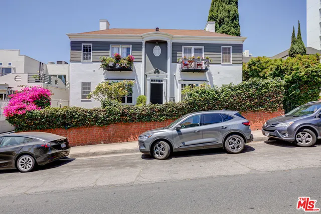 a car parked in front of a house