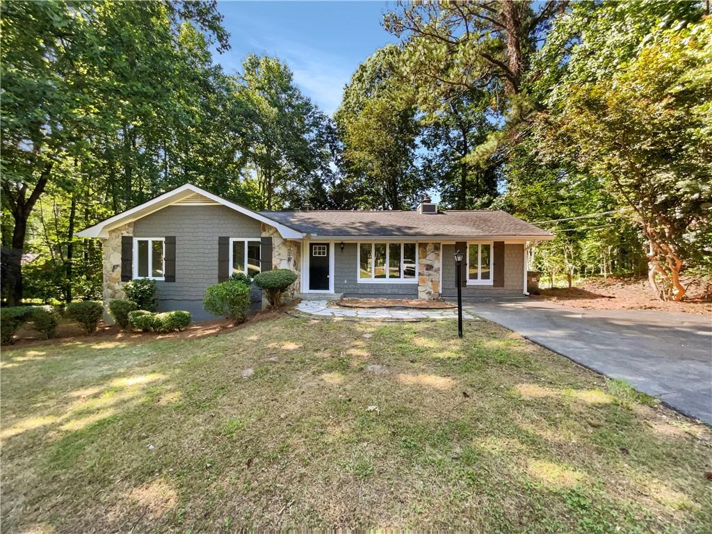 1566 Jimmy Dodd Road Buford, GA 30518 - Photo 1 of 1 a front view of a house with a yard