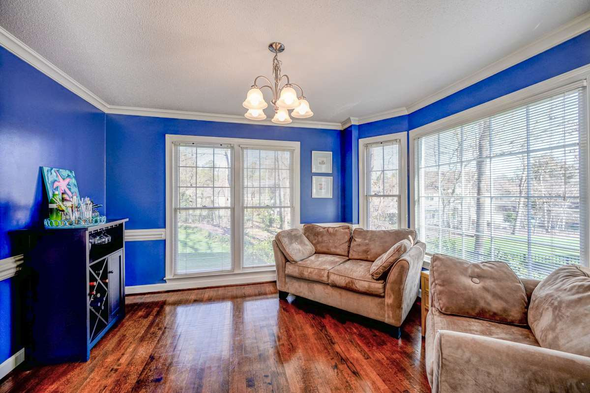 7017 Cedar Bend Court Raleigh, NC 27612 - Photo 13 of 30 This lovely room has hardwood Floors, 5 Window including Bay, Coved Crown Molding, 2 Piece Chair-Rail and a Pocket Door Access to the Kitchen. Dining Room