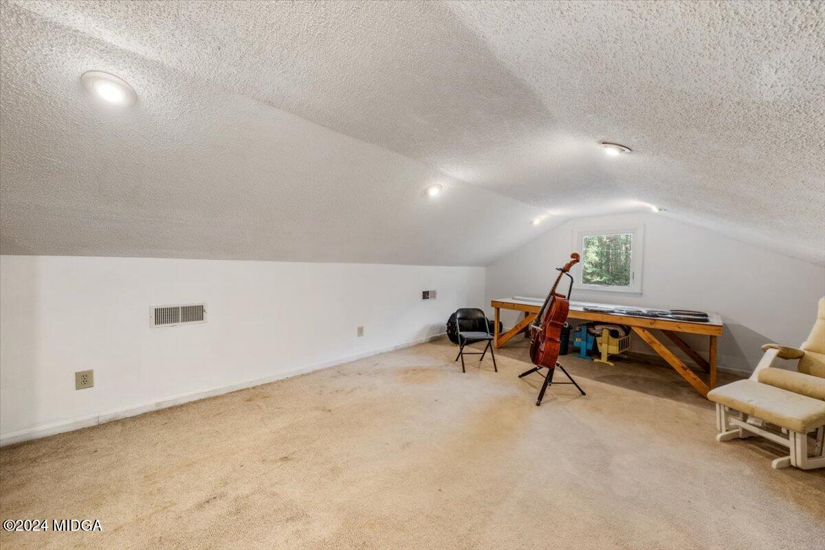 2559 Reedy Creek Road Forsyth, GA 31029 - Photo 14 of 20 a living room with furniture and a table