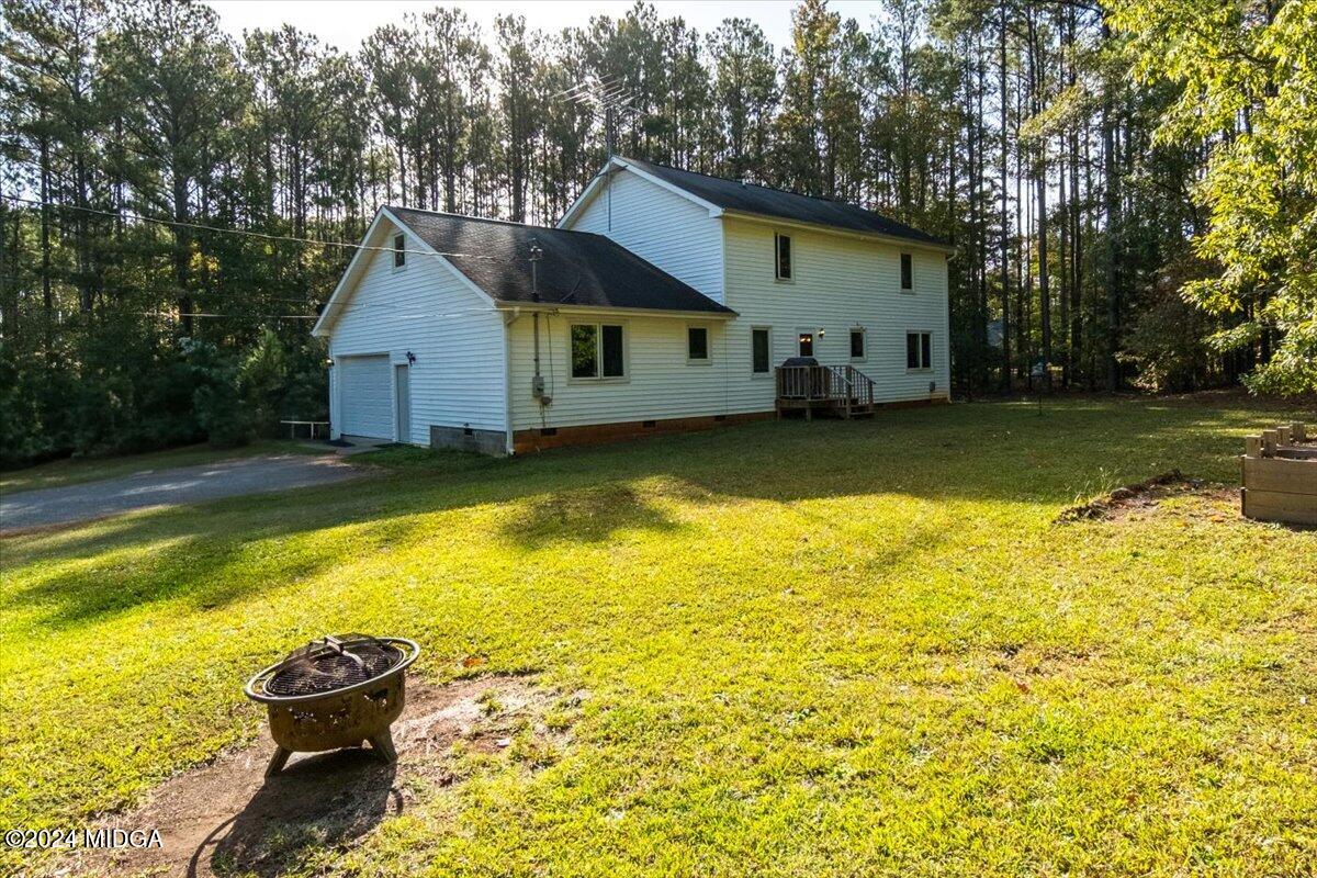 2559 Reedy Creek Road Forsyth, GA 31029 - Photo 17 of 20 a view of a house with a yard and sitting area