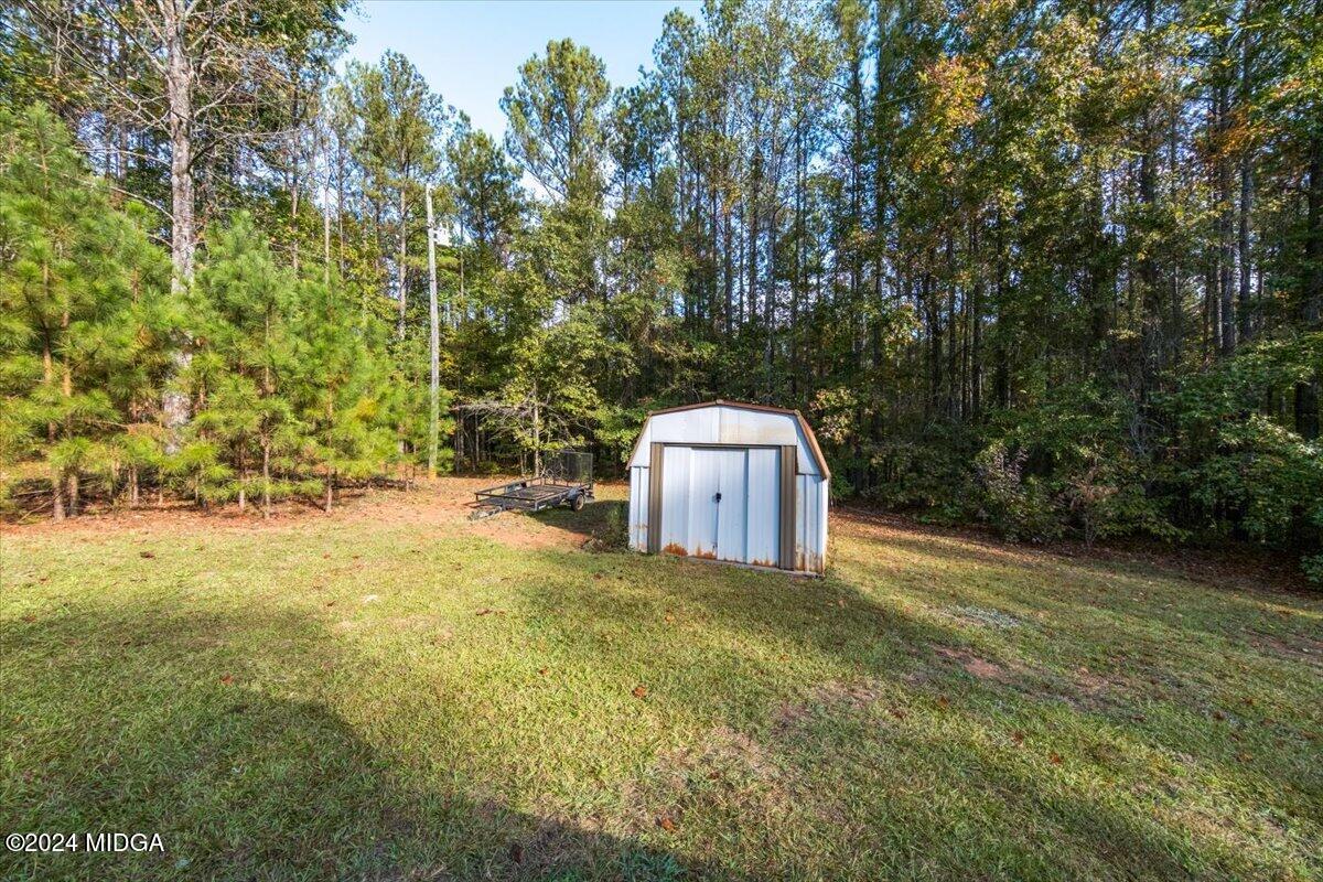 2559 Reedy Creek Road Forsyth, GA 31029 - Photo 20 of 20 a view of a back yard
