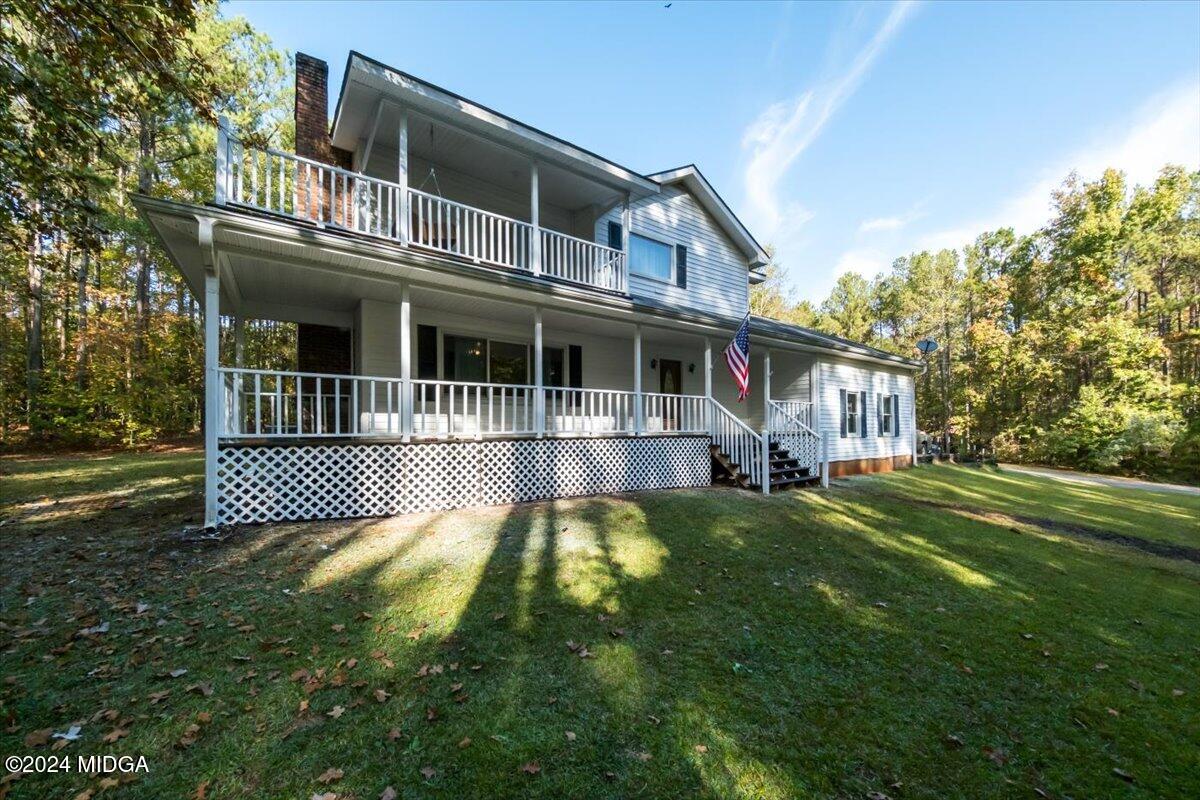 2559 Reedy Creek Road Forsyth, GA 31029 - Photo 2 of 20 a view of a house with a yard