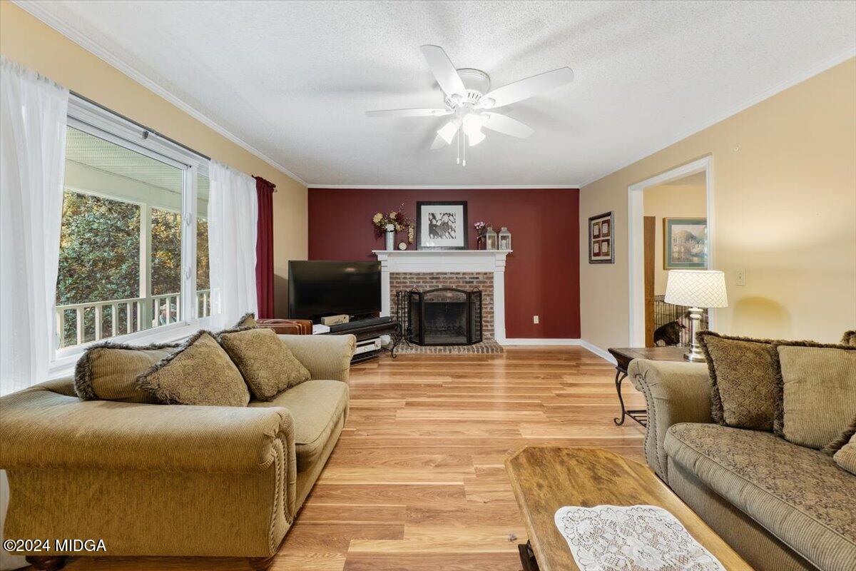 2559 Reedy Creek Road Forsyth, GA 31029 - Photo 4 of 20 a living room with furniture and a fireplace