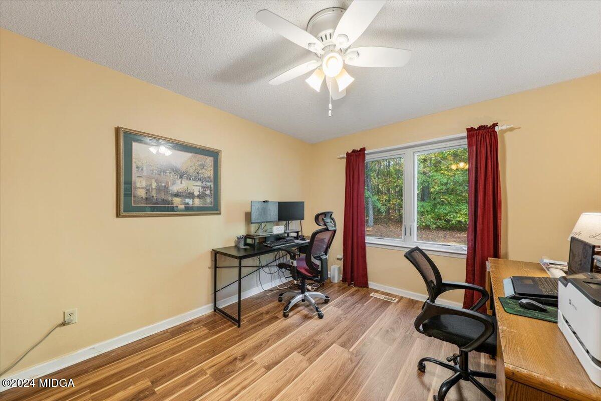 2559 Reedy Creek Road Forsyth, GA 31029 - Photo 8 of 20 a view of a workspace with furniture and a window