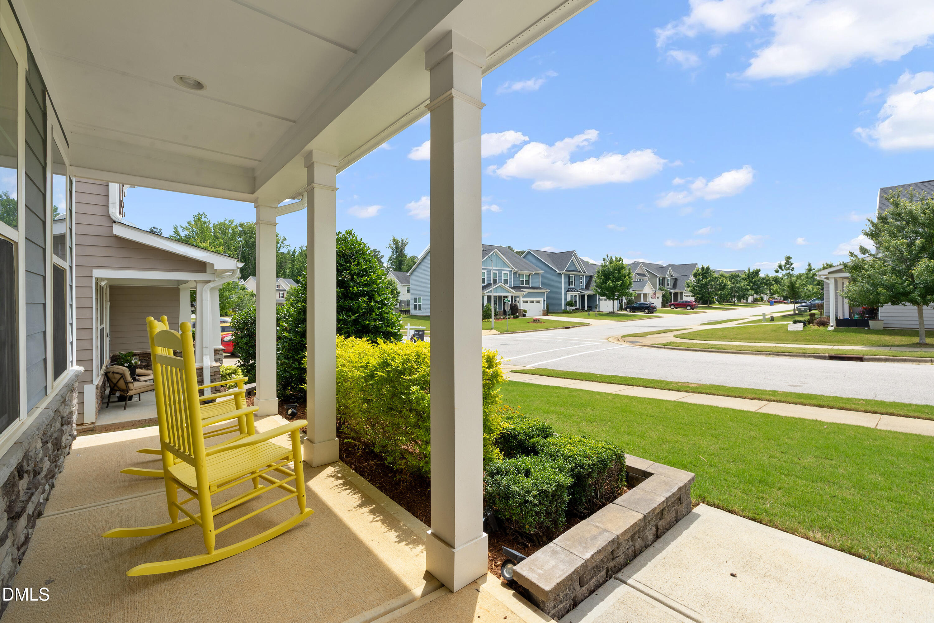 8059 Gilano Drive Raleigh, NC 27603 - Photo 9 of 43 a view of a patio with table and chairs potted plants with wooden floor and fence