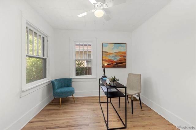 a workspace room with furniture and windows
