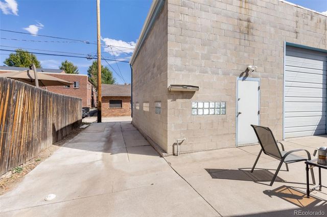 a view of a backyard with sitting area