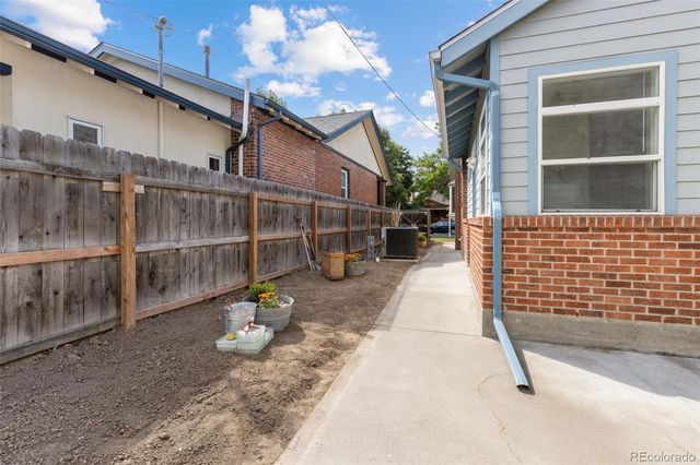 a view of a patio with a table and chairs