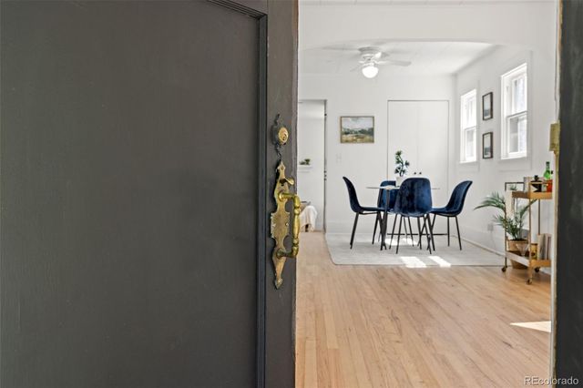 a view of dining room with furniture and wooden floor