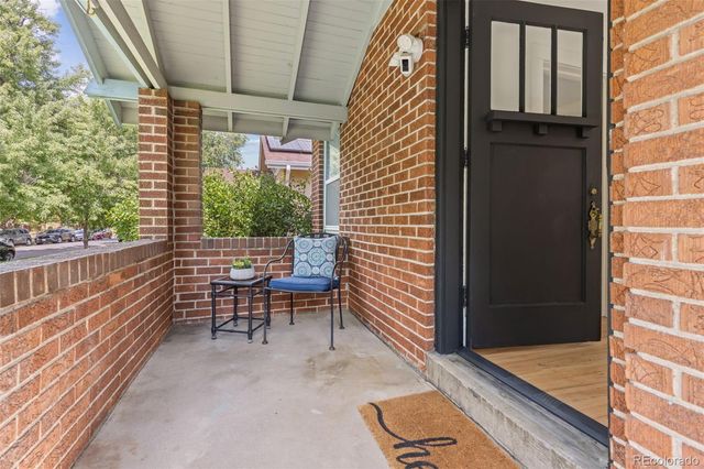 an aerial view of residential houses with outdoor space and parking